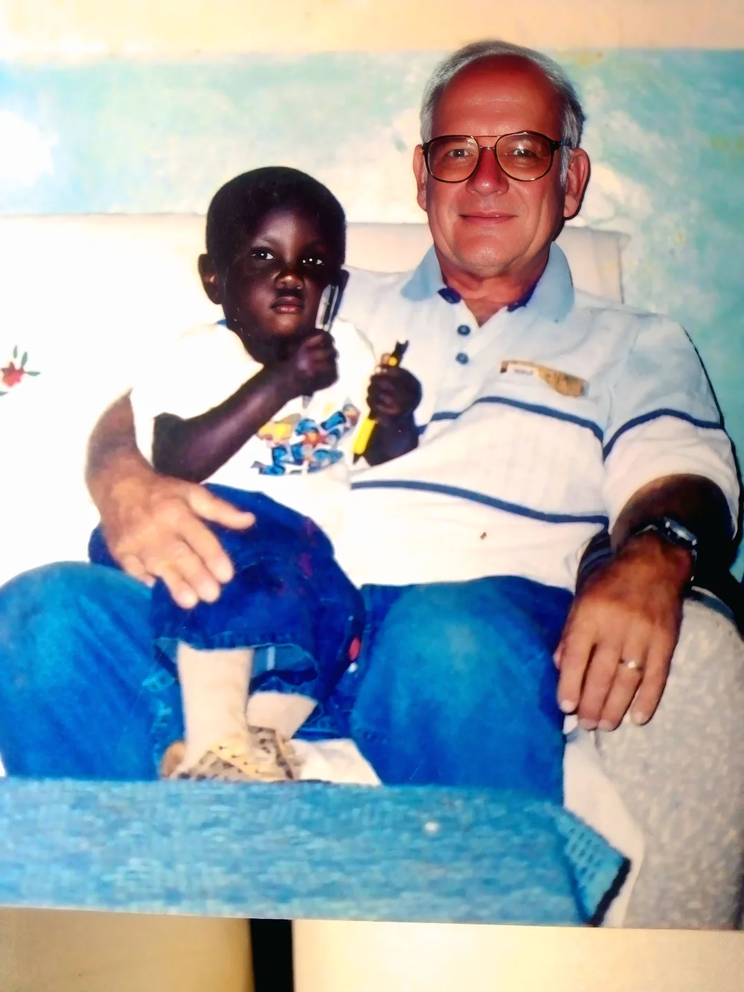 Eugine Micah as a boy with his grandfather David Zarembka