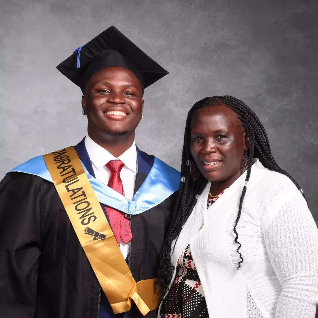 Eugine Micah with his mother at his TIBS graduation